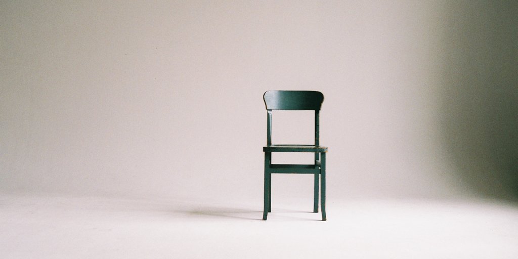 An empty chair in an empty room